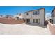 Backyard featuring a spacious gravel area, surrounded by block walls for privacy at 72 Via Montoro, Henderson, NV 89011