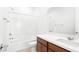 Bathroom featuring a shower-tub combo and vanity with a dark wood cabinet at 72 Via Montoro, Henderson, NV 89011