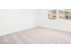 Bright bedroom with neutral carpet and two large windows offering mountain views at 72 Via Montoro, Henderson, NV 89011