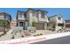 Charming two-story home featuring modern architectural design, neat landscaping, and a paved driveway at 72 Via Montoro, Henderson, NV 89011