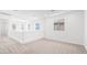 Bright, open loft area with neutral carpet, white walls, and natural light at 72 Via Montoro, Henderson, NV 89011