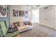 Comfortable living room featuring a record player, couch, and unique art pieces at 7371 Hayes Harbor Ct Dr # Lot 209, North Las Vegas, NV 89084