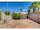 Backyard featuring a block wall, clear blue sky, and palm trees at 7417 Radville Dr, Las Vegas, NV 89129