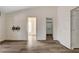 Neutral bedroom with laminate flooring and views to the bathroom and closet at 7417 Radville Dr, Las Vegas, NV 89129
