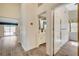 Hallway view with bathroom, bedroom and open sliding glass door views at 7417 Radville Dr, Las Vegas, NV 89129