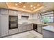Bright kitchen with stainless appliances, light countertops, wood ceilings, and lots of cabinet space at 7417 Radville Dr, Las Vegas, NV 89129