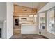 Eat-in kitchen with wood ceiling, modern lighting, and updated appliances at 7417 Radville Dr, Las Vegas, NV 89129