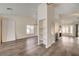 Inviting living area featuring stylish wood flooring, built-in shelving, and a cozy fireplace at 7417 Radville Dr, Las Vegas, NV 89129