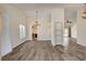 Open-concept living area with wood floors, neutral walls, and views of the kitchen and Gathering room at 7417 Radville Dr, Las Vegas, NV 89129