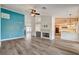 Open-concept living room with a fireplace and bar, connecting to the kitchen at 7417 Radville Dr, Las Vegas, NV 89129