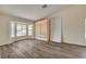 Spacious living area showcasing wood floors, a bay window, and ample natural light at 7417 Radville Dr, Las Vegas, NV 89129