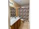 Bathroom with white countertop and colorful shower curtain at 7850 Flagler St, Las Vegas, NV 89139