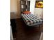 Cozy bedroom featuring wood floors, with natural light and built-in shelves for storage at 7850 Flagler St, Las Vegas, NV 89139
