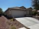 Charming single-story home with a two-car garage, low-maintenance desert landscaping, and a covered front porch at 7850 Flagler St, Las Vegas, NV 89139