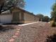 Exterior view showing gravel yard, sidewalk, and covered porch of the single-story house at 7850 Flagler St, Las Vegas, NV 89139