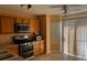 Kitchen boasts stainless steel appliances, wood cabinets, and laminate counters at 7850 Flagler St, Las Vegas, NV 89139