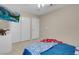 Bedroom featuring neutral walls, carpeted floors, and a wall mounted TV at 7937 Granite Walk Ave, Las Vegas, NV 89178