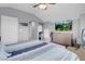 Large bedroom with lounge area, television, and carpeted floors at 7937 Granite Walk Ave, Las Vegas, NV 89178