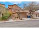 Two-story home with a two-car garage and low-maintenance landscaping in a residential neighborhood at 7937 Granite Walk Ave, Las Vegas, NV 89178