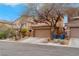 Two-story home with desert landscaping and a two-car garage in a quiet neighborhood at 7937 Granite Walk Ave, Las Vegas, NV 89178