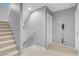 Hallway featuring gray walls, neutral carpeted floors, and a staircase at 7937 Granite Walk Ave, Las Vegas, NV 89178