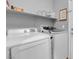 Laundry room features a Samsung washer and dryer with shelving at 7937 Granite Walk Ave, Las Vegas, NV 89178