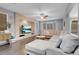 Spacious living room with a stone entertainment center and a comfortable sectional sofa at 7937 Granite Walk Ave, Las Vegas, NV 89178