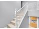Carpeted staircase with white railings and gray walls at 7937 Granite Walk Ave, Las Vegas, NV 89178