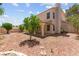 Spacious backyard featuring stone mulch and a covered patio perfect for outdoor entertaining and relaxation at 8934 Pomona Ct, Las Vegas, NV 89147