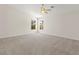Spacious bedroom with neutral carpet and two windows at 8934 Pomona Ct, Las Vegas, NV 89147