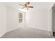 Bedroom features include a neutral color scheme, carpet, and window at 8934 Pomona Ct, Las Vegas, NV 89147