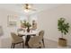 Cozy dining area featuring a modern table, stylish chairs, and natural light from large windows at 8934 Pomona Ct, Las Vegas, NV 89147
