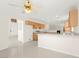 Open kitchen with tile flooring, white countertop, and ceiling fan at 8934 Pomona Ct, Las Vegas, NV 89147