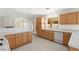 Open kitchen boasts bright lighting, ample cabinet space, and modern appliances at 8934 Pomona Ct, Las Vegas, NV 89147