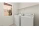 Functional laundry room with a white washer and dryer at 8934 Pomona Ct, Las Vegas, NV 89147