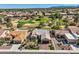 Desirable aerial view of a home with lush golf course views, beautifully landscaped yard, and inviting curb appeal at 10013 Hunter Springs Dr, Las Vegas, NV 89134