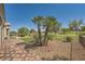 A backyard with palm trees and green views at 10013 Hunter Springs Dr, Las Vegas, NV 89134