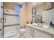 Bathroom with a glass shower and vanity with lighting and mirror at 10013 Hunter Springs Dr, Las Vegas, NV 89134