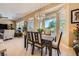 Dining room with views to the backyard flows seamlessly to the living room at 10013 Hunter Springs Dr, Las Vegas, NV 89134