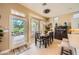 A breakfast nook features an elegant chandelier and views to the backyard at 10013 Hunter Springs Dr, Las Vegas, NV 89134