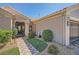 Inviting front entrance with a custom iron gate and meticulously landscaped pathway at 10013 Hunter Springs Dr, Las Vegas, NV 89134