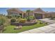 Beautiful home with artificial turf, rock landscaping, and a paved driveway at 10013 Hunter Springs Dr, Las Vegas, NV 89134
