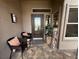 Cozy front porch features seating, decor, and patterned pavers at 10013 Hunter Springs Dr, Las Vegas, NV 89134