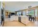 Bright open kitchen and living space features an island and modern design at 10013 Hunter Springs Dr, Las Vegas, NV 89134