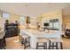 Modern kitchen with an island with seating, lots of cabinets and stainless steel appliances at 10013 Hunter Springs Dr, Las Vegas, NV 89134