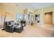 Bright living room with tile flooring, large windows, and comfortable seating at 10013 Hunter Springs Dr, Las Vegas, NV 89134