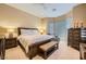 A bedroom with neutral colors and a ceiling fan above the bed at 10013 Hunter Springs Dr, Las Vegas, NV 89134