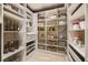A walk-in pantry features ample white shelving and storage space at 10013 Hunter Springs Dr, Las Vegas, NV 89134