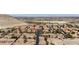 Expansive aerial shot showcasing homes with well-maintained landscaping, and mountain views at 10180 Delray Beach Ave # 202, Las Vegas, NV 89129