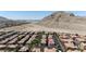 Aerial view of a well-planned neighborhood, showcasing a residential area near a mountain at 10180 Delray Beach Ave # 202, Las Vegas, NV 89129